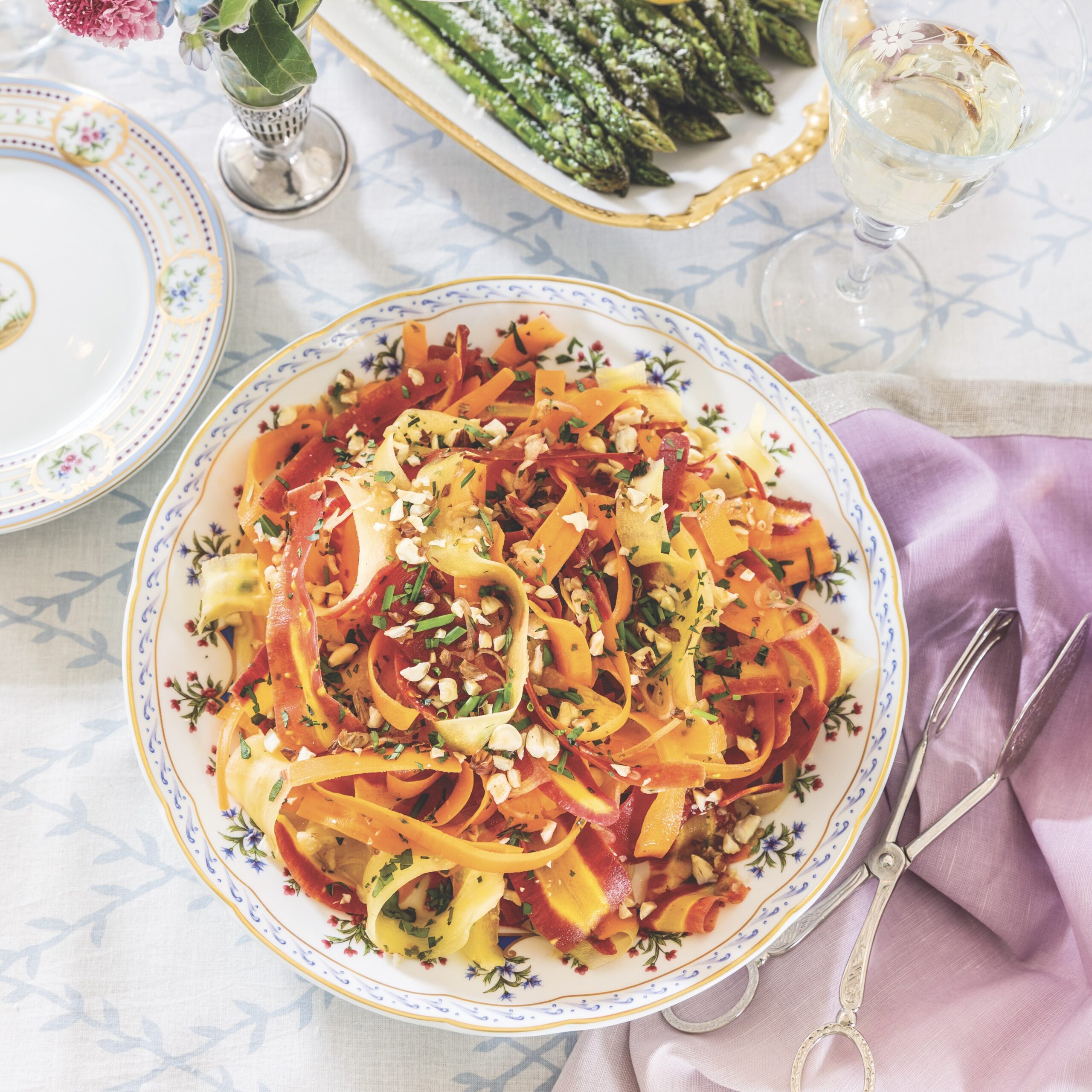 shaved carrot salad in a china bowl