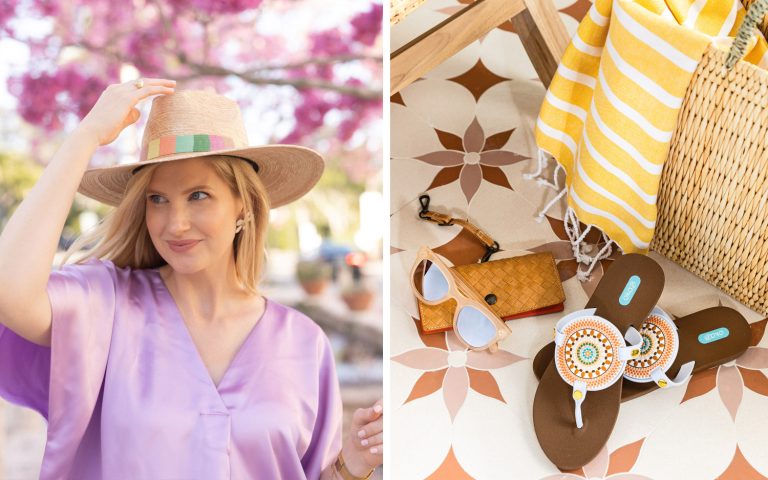Ashley Brooke in a woven hat next to travel accessories