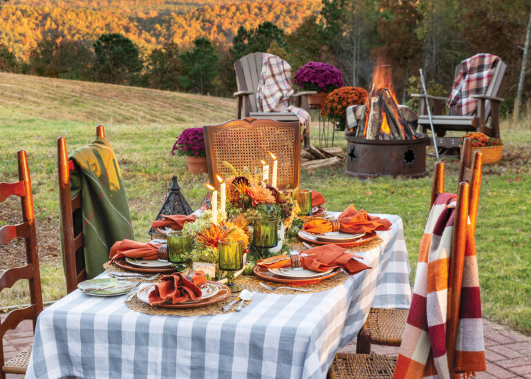Fall tablescape with bonfire in the background