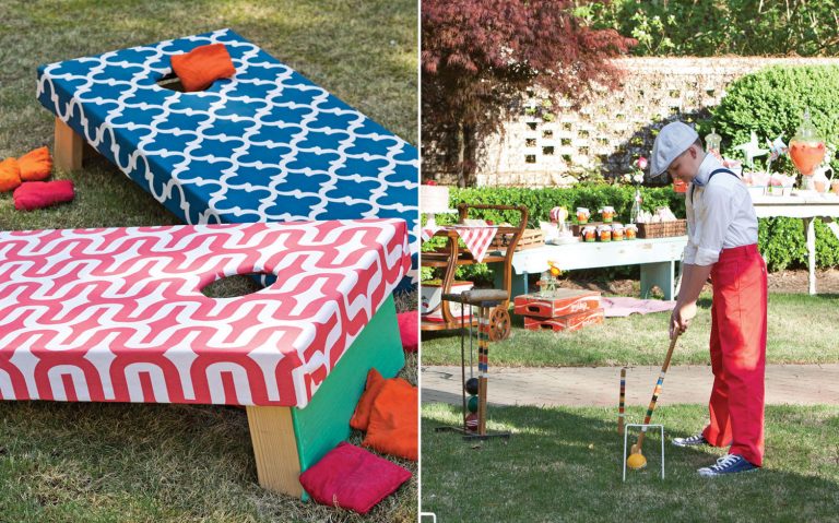 A photo of a child playing crochet and cornhole boards