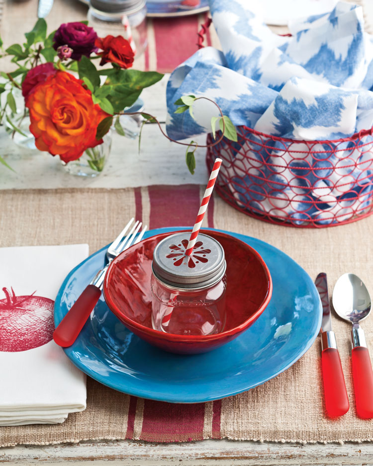 A photo of a red and white table setting