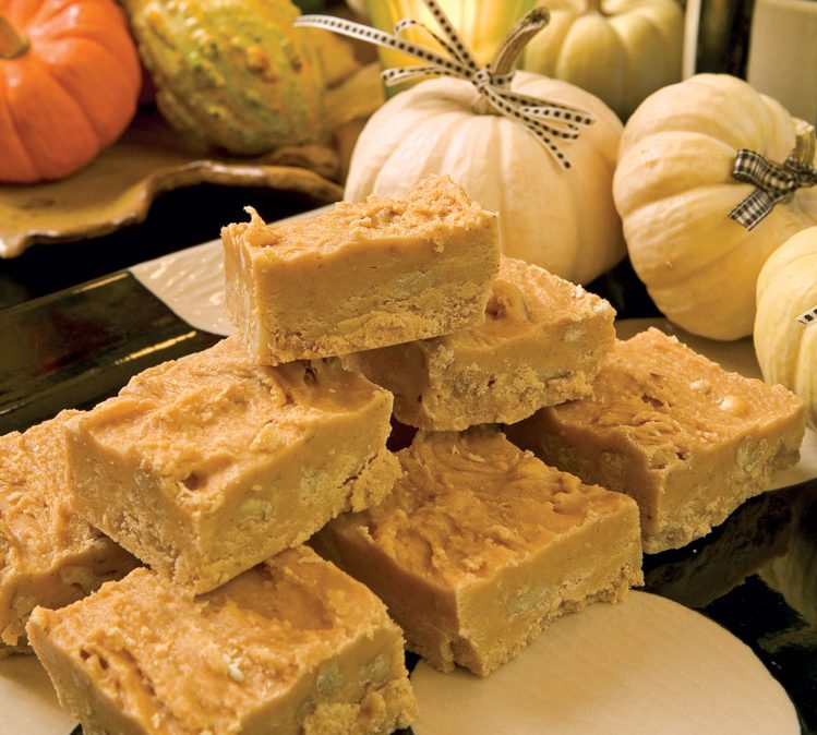 Pumpkin Fudge stacked next to mini pumpkins