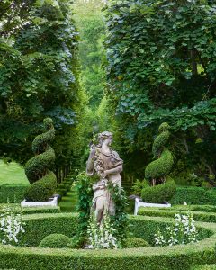 A photo of the statue and grove of trees in the Parterre Garden at Carolyne Roehm's Weatherstone