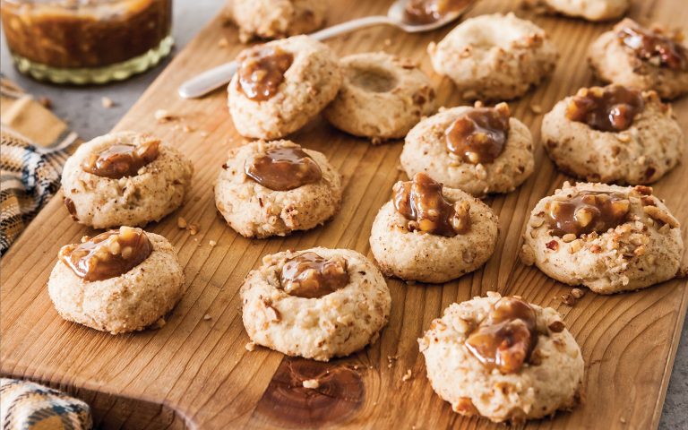Pecan Pie Thumbprint Cookies on a wooden board