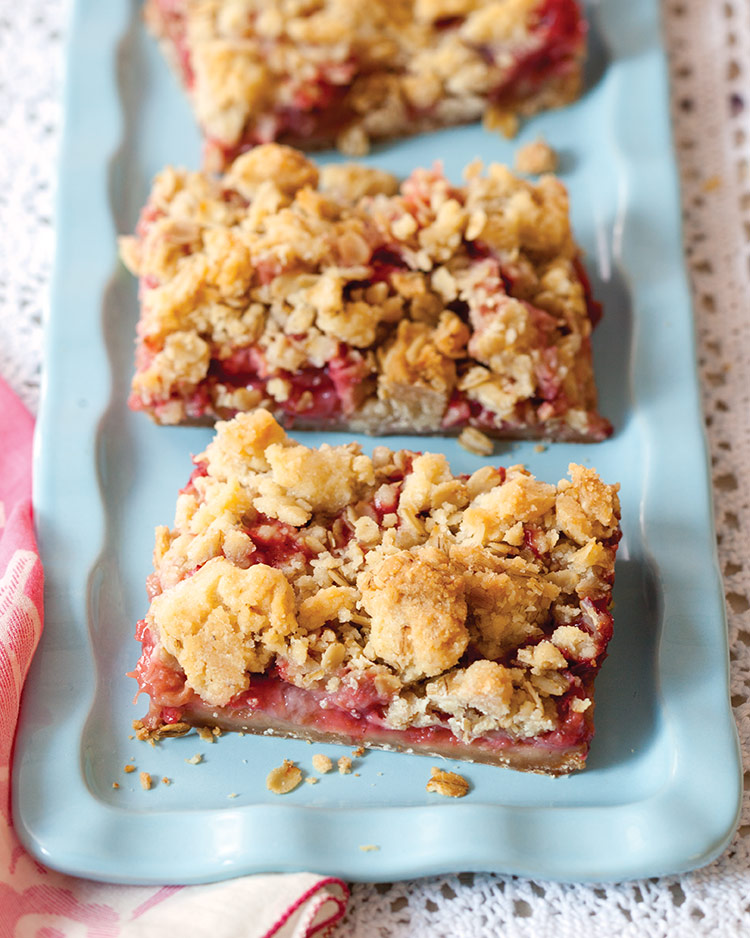 Old-Fashioned Goodies Strawberry Rhubard Crumble Bars on a blue rectangular tray