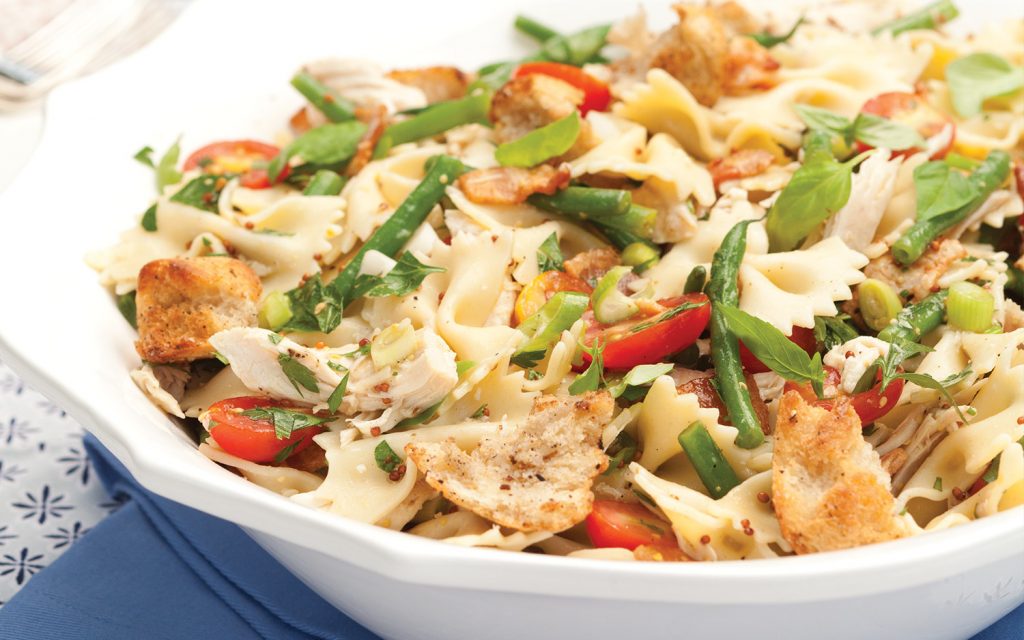 Chicken Pasta Salad in a white serving bowl