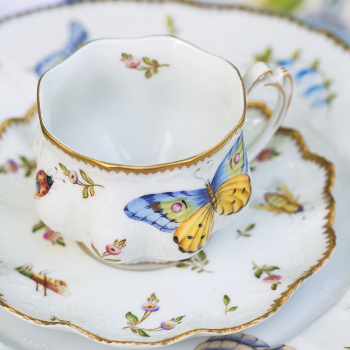 Butterfly-adorned teacup and saucer