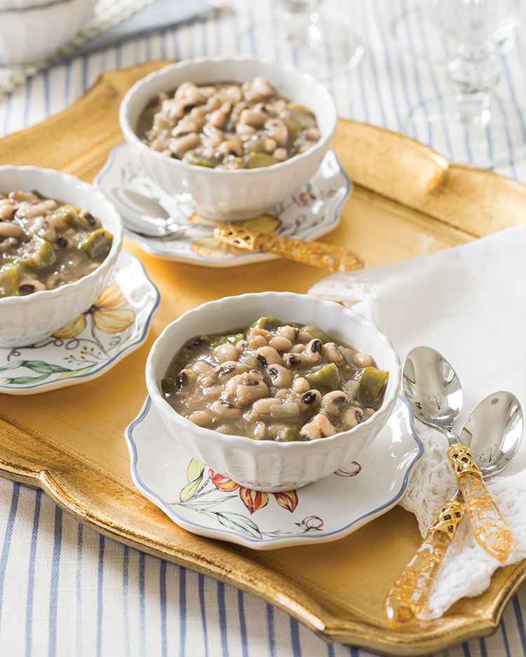 Bowls of black-eyed peas on a gold tray