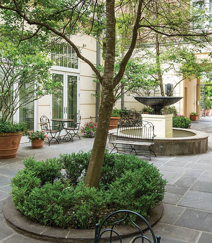 Fountain, trees, and iron furnishings in a Greenwood, Mississippi, park