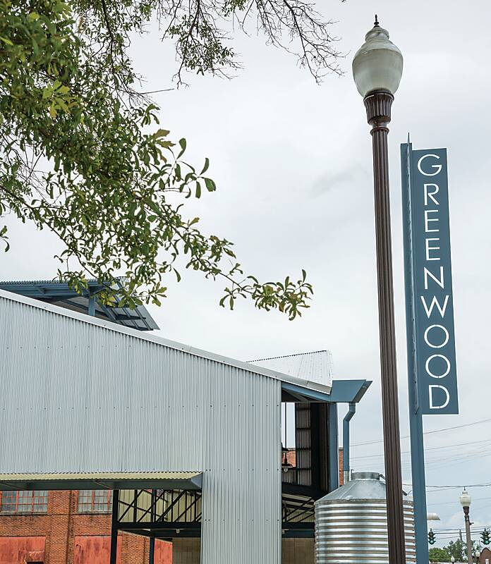 Street scene and Greenwood sign in Mississippi