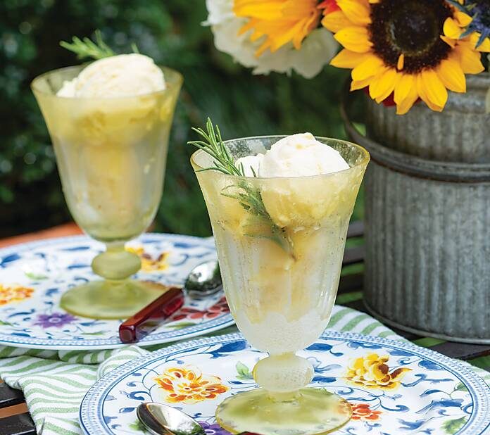 Two glasses of ice cream on floral plates