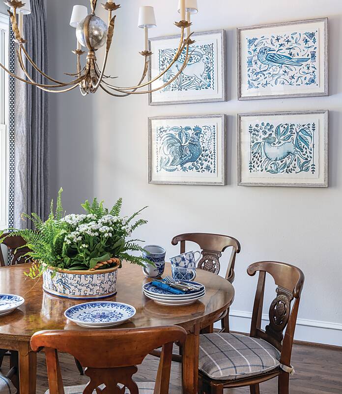 Breakfast nook with dark wood table and chairs and blue-and-white decor