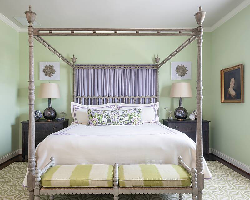 Green-painted bedroom with four-poster bed