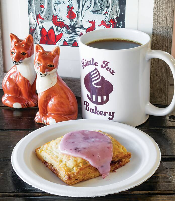 Coffee, pastry, and fox figurines