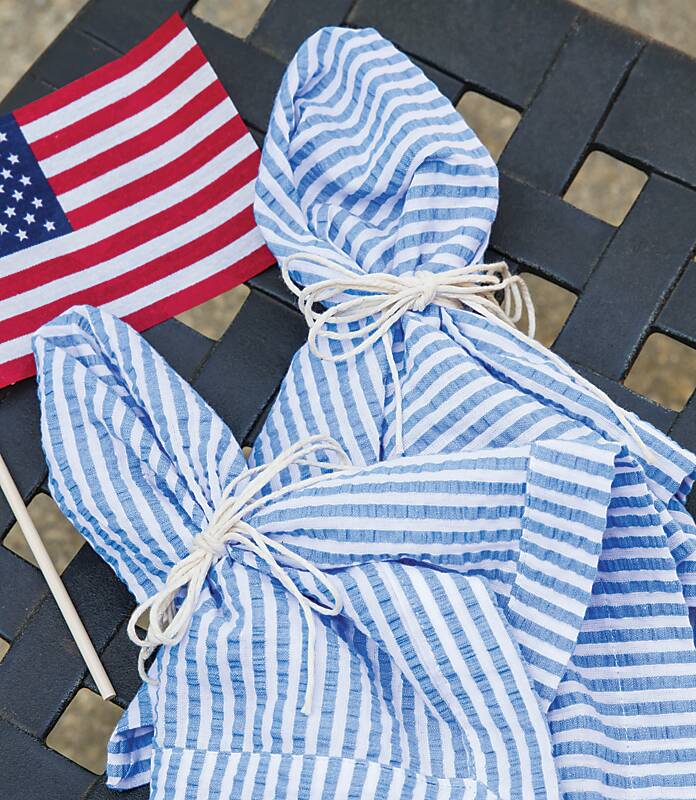 Blue seersucker napkins and a small American flag for Labor Day activities