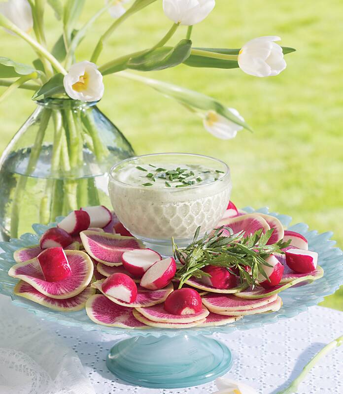 Mixed Radishes with Green Goddess Dressing on a blue cake stand