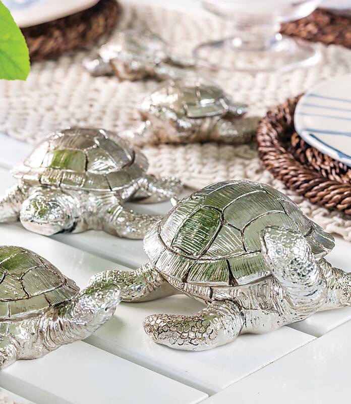 Three decorative silver turtles
