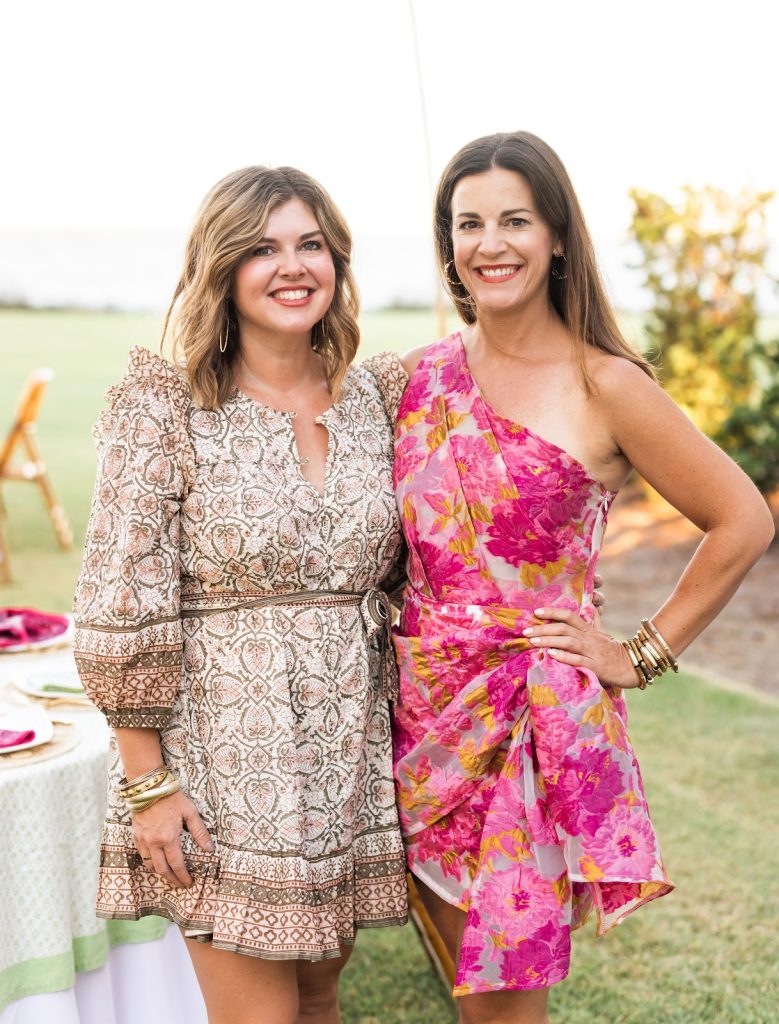 Two women in dresses outside