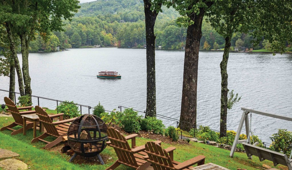 Adirondack chairs overlook Lake Toxaway at The Greystone Inn