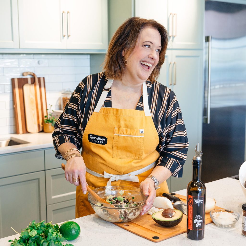 A woman smiling in a kitchen