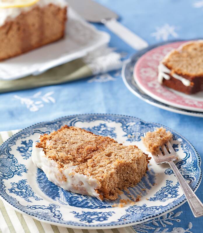 A slice of Sweet Tea Poke Pound Cake on a blue-and-white plate
