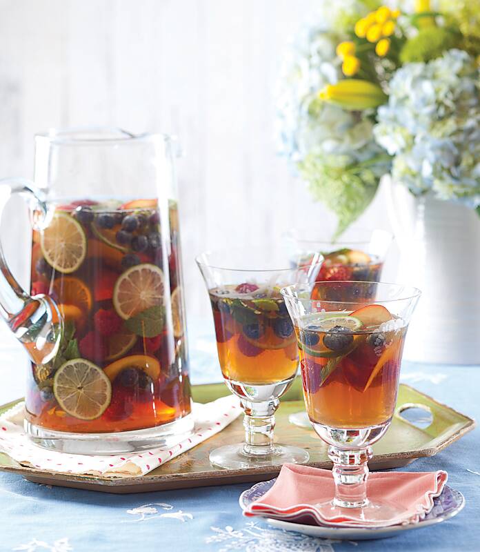 A pitcher and three glasses of Sweet Tea Sangria