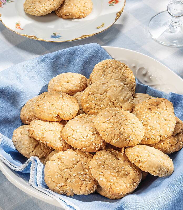 Benne Wafers in a white dish lined with a pale blue linen