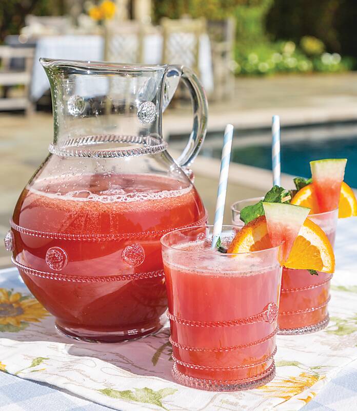 Watermelon Spritzer in two glasses and a pitcher