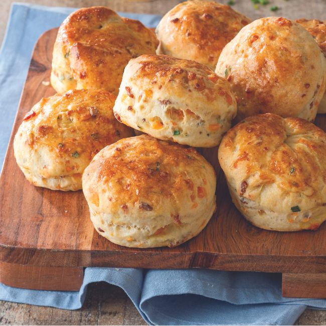 Bacon-Cheddar Angel Biscuits on a wooden board