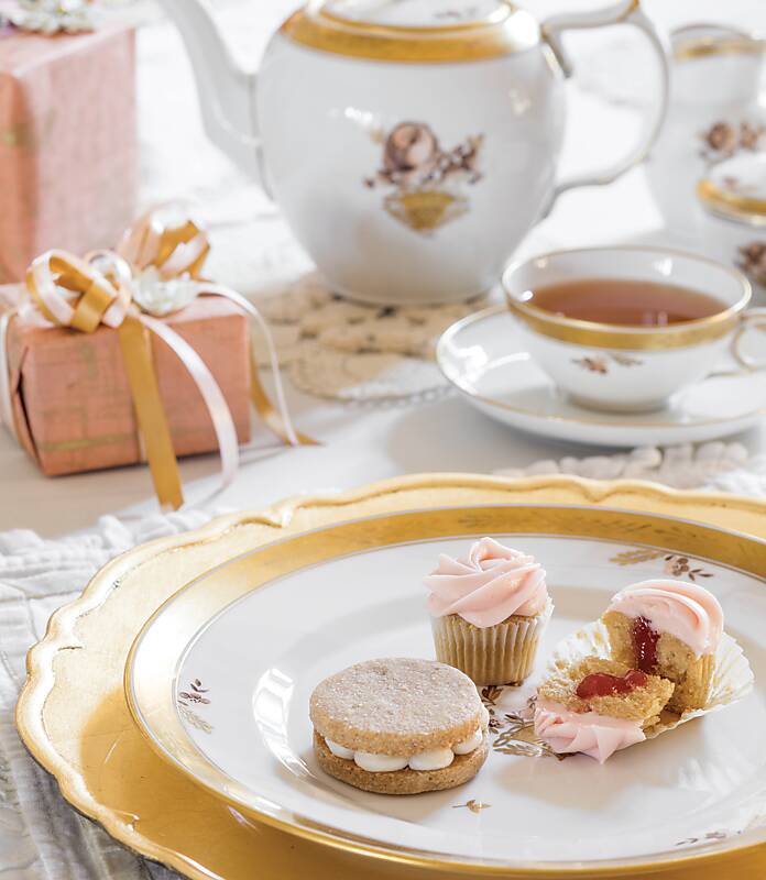 Teatime treats on white and gold china