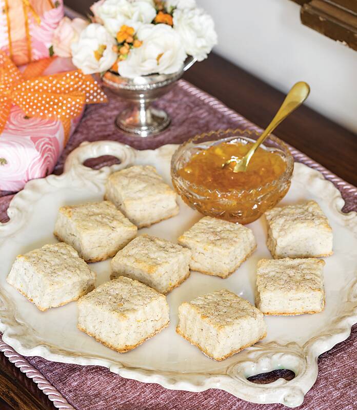 Cinnamon-Sugar Scones on a white platter with a bowl of orange marmalade