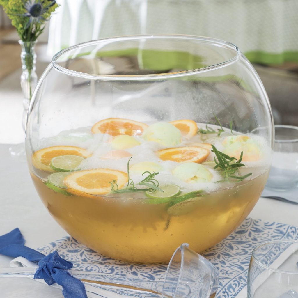 Citrus-Rosemary Punch in a clear punch bowl