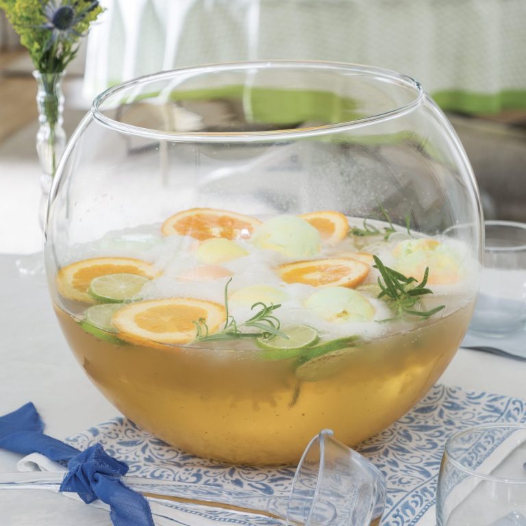 Citrus-Rosemary Punch in a clear punch bowl