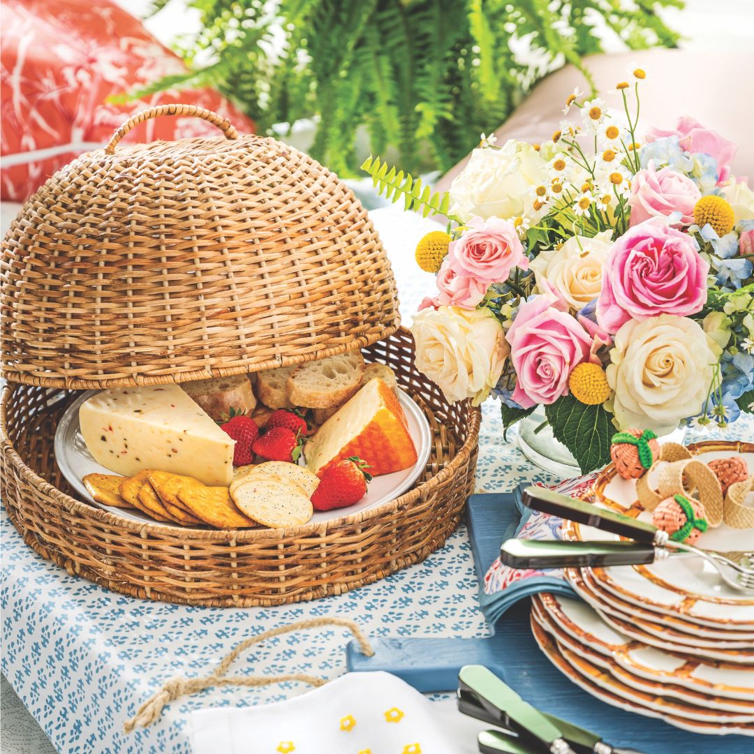 Cheese and crackers in a wicker cloche