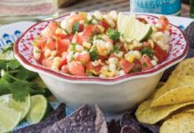 7 Easy Snacks and Sides for Any Get-Together Bowl of corn and tomato salsa with chips for snacks and sides