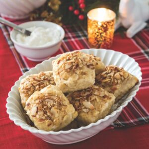 Pinch of Warmth: Roasted Pear, Cardamom & Almond Scones in a white dish