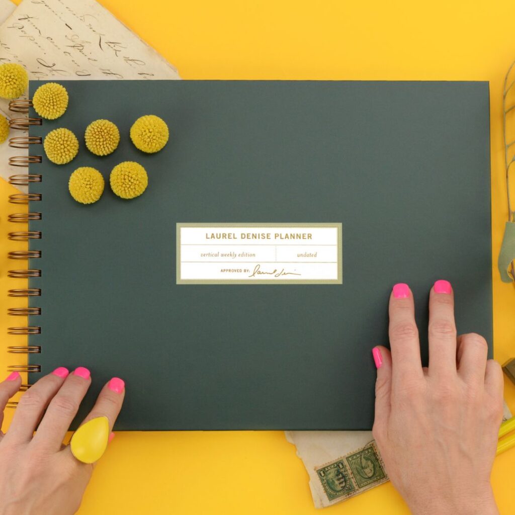 Green planner on a mustard backdrop for back-to-school days