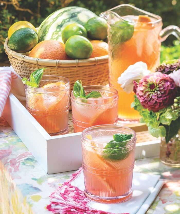 Grapefruit-Basil Fizz in a pitcher and several glasses