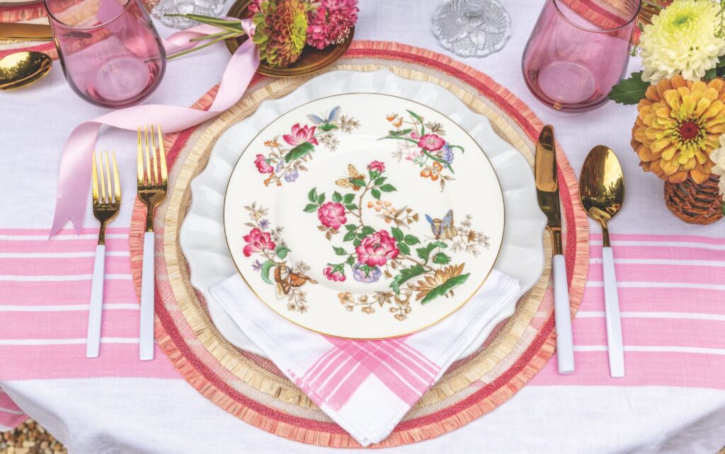 Place setting with floral china and pink accents