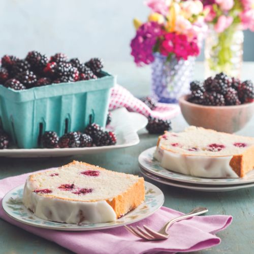 Blackberry Buttermilk Bread Slices and a carton of fresh blackberries