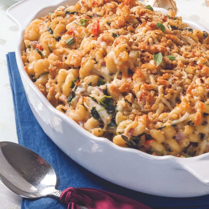 Spinach-Chicken Casserole with Cavatappi in a white oblong dish