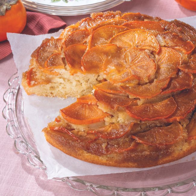 Persimmon-Ginger Upside-Down Cake on parchment and a clear dish