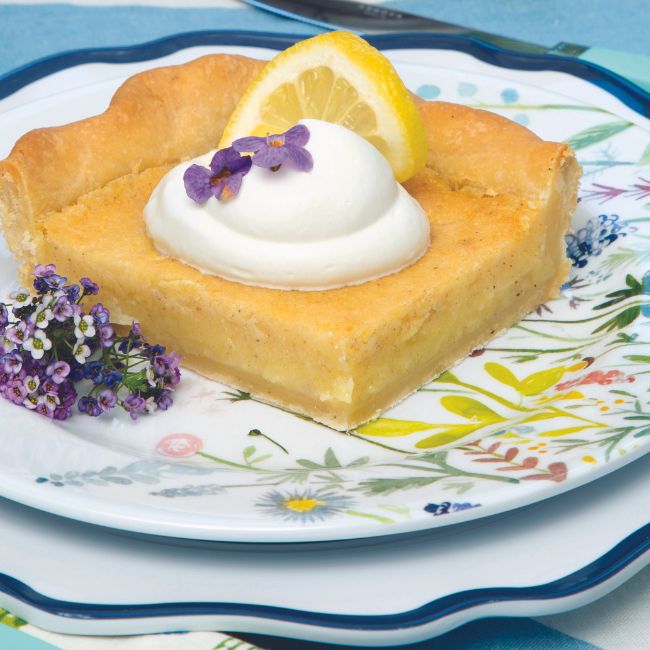 Buttermilk Slab Pie sliced on a floral plate