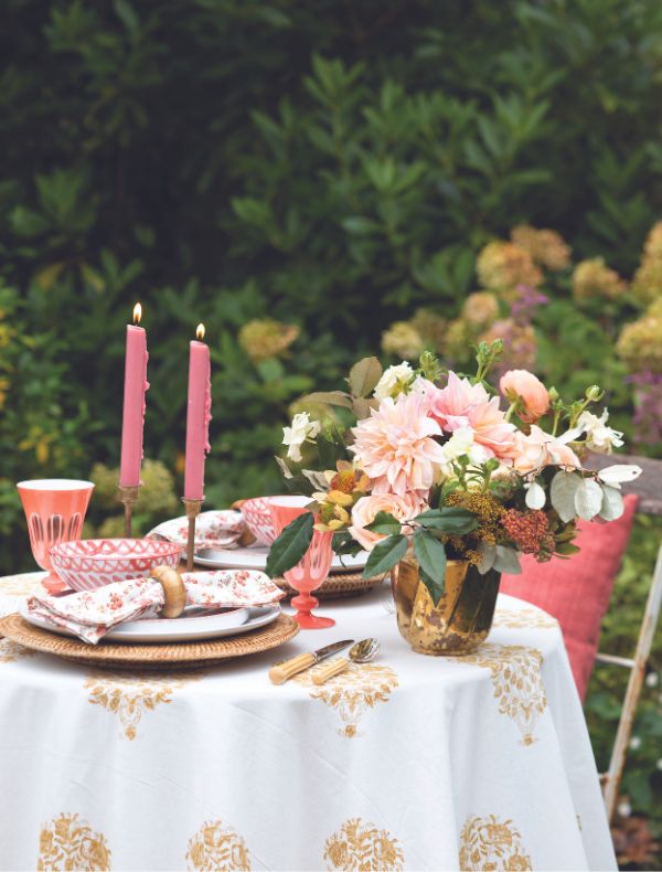 Gold, white, and coral outdoor tablescape