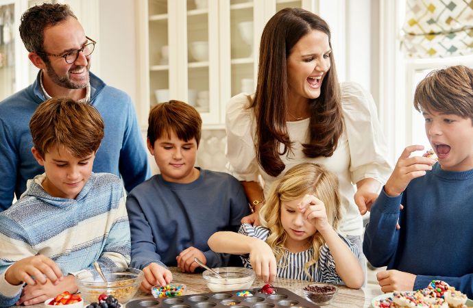 A family of 5 at a kitchen counter together