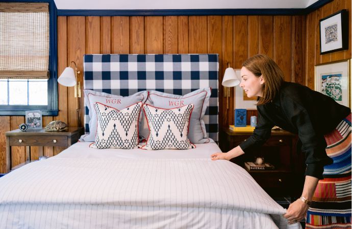 Wood paneled bedroom with navy and white details