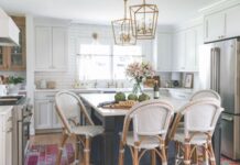 White Kitchen Refresh: Our Top Tips for Warming Up This Essential Space all-white kitchen with dark blue island
