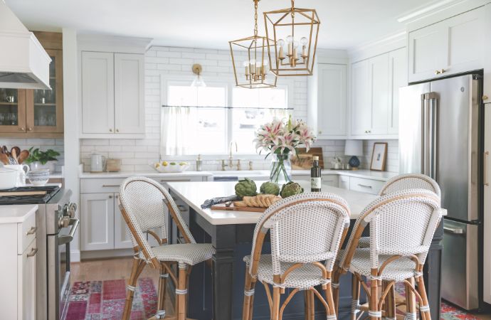 all-white kitchen with dark blue island