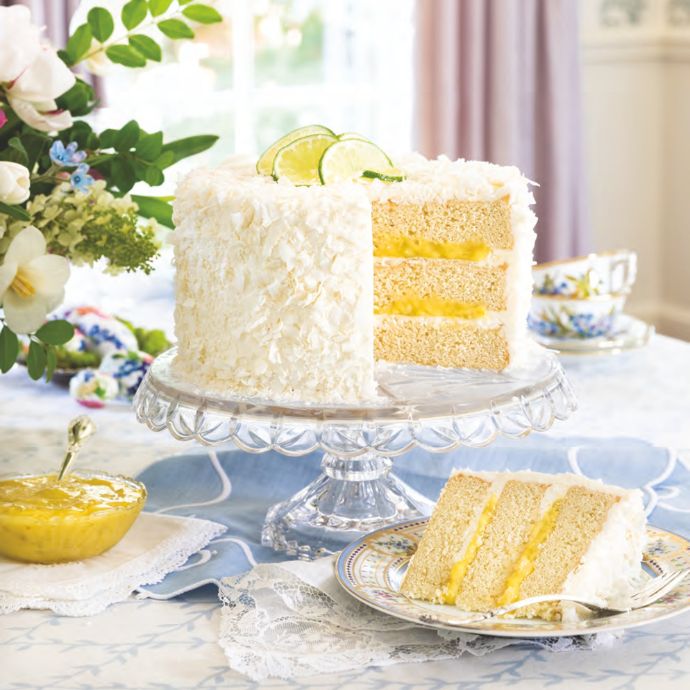 Coconut-Lime Cake on a clear stand