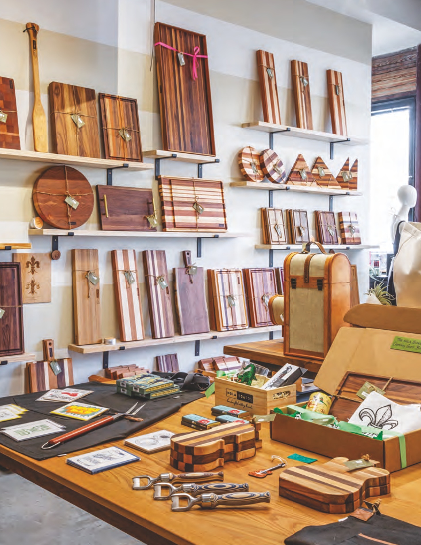 Cutting boards on shelves at Nola Boards